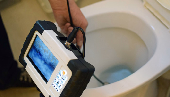 overflowing toilet causing water backup